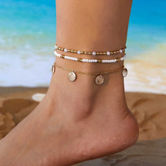 Starfish conch shell pearl multi-layer anklet on ankle at the beach