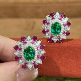 Colorful stud earrings with oval green zircon center, surrounded by white and pink geometric stones in white gold setting for women