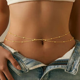 Personalized fashion double-layer gold waist chain with round beads on model's waist