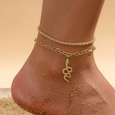 Gold fashion twist snake pendant double circle anklet on sandy foot