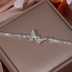 Silver women's anklet with inlaid rhinestone butterfly design and alloy material
