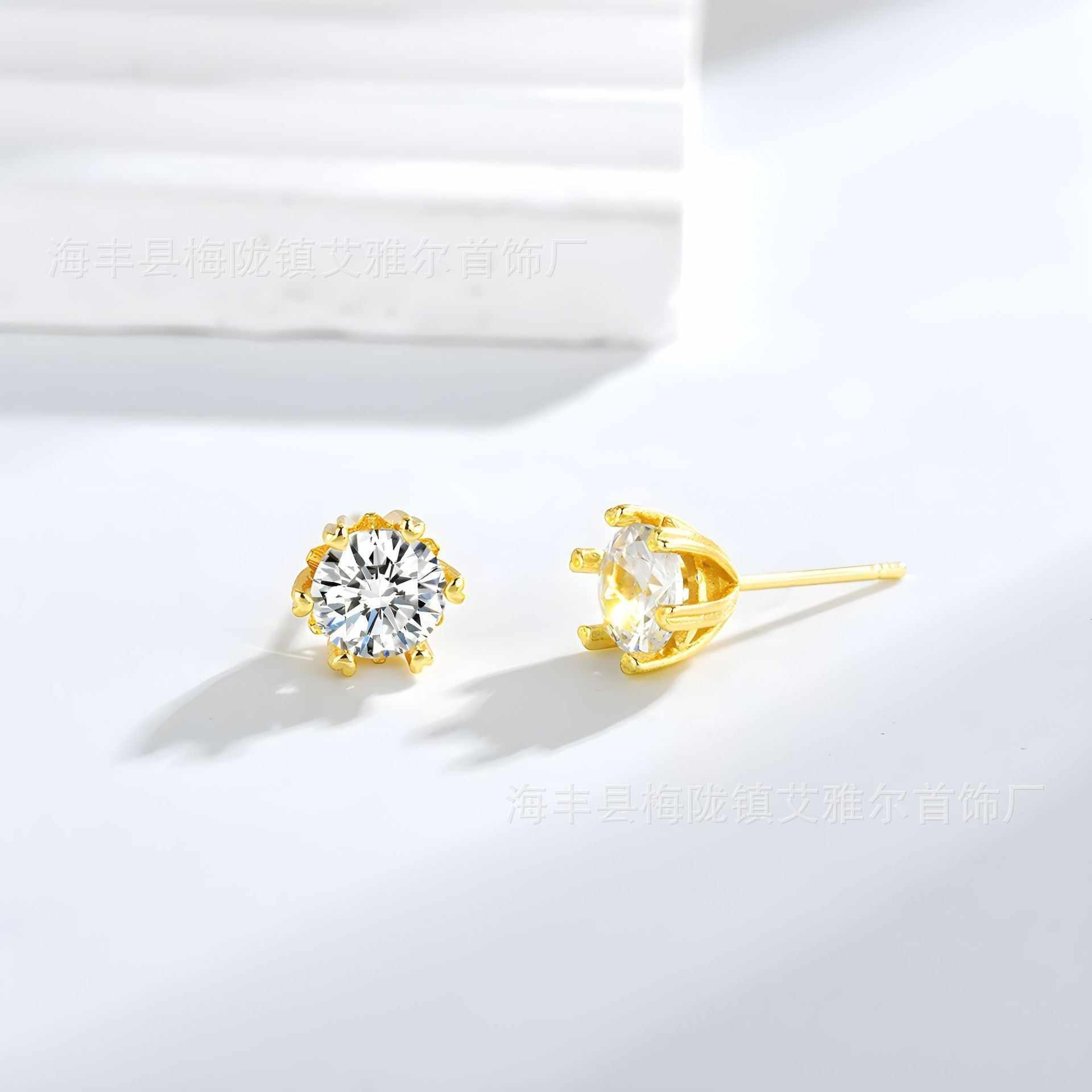 gold brass zircon stud earrings with six-claw setting on white background
