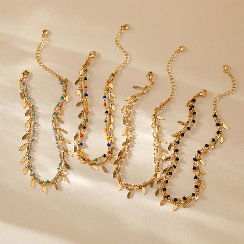Beach layered retro 18K gold plated copper anklets with colorful beads and leaf charms.