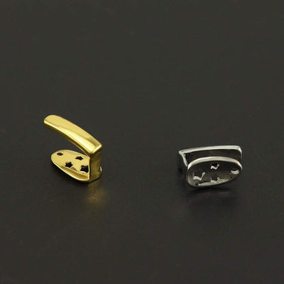 gold and silver electroplated metal Teeth Joint pieces on black background