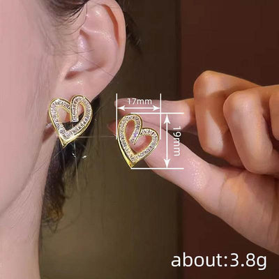Yellow gold hollowed heart shape zircon inlaid elegant ear studs for women