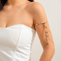 Europe and America style ethnic butterfly flower tassel arm chain bracelet on woman wearing white corset dress