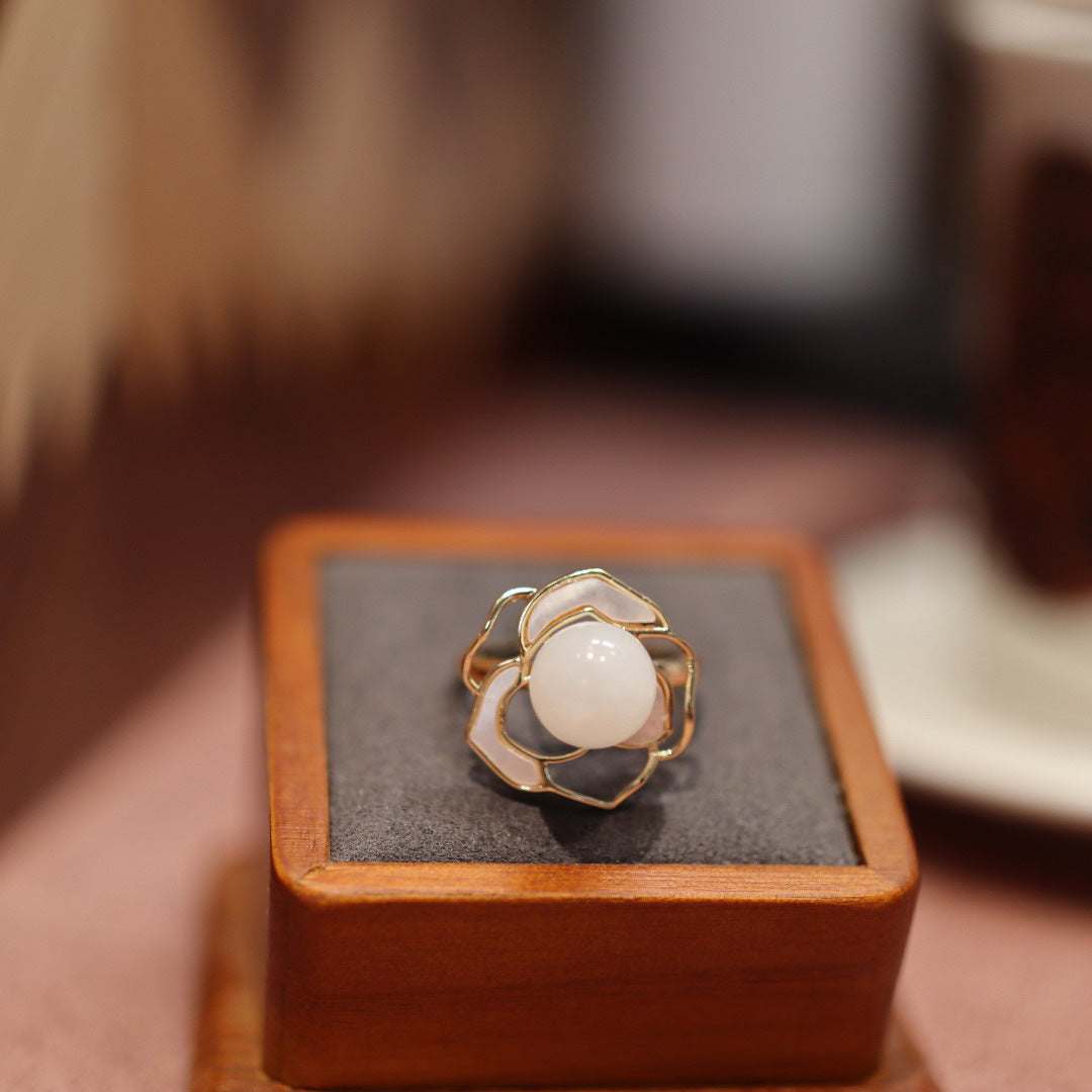 Natural Hetian white jade ring with gold flower design on wooden box