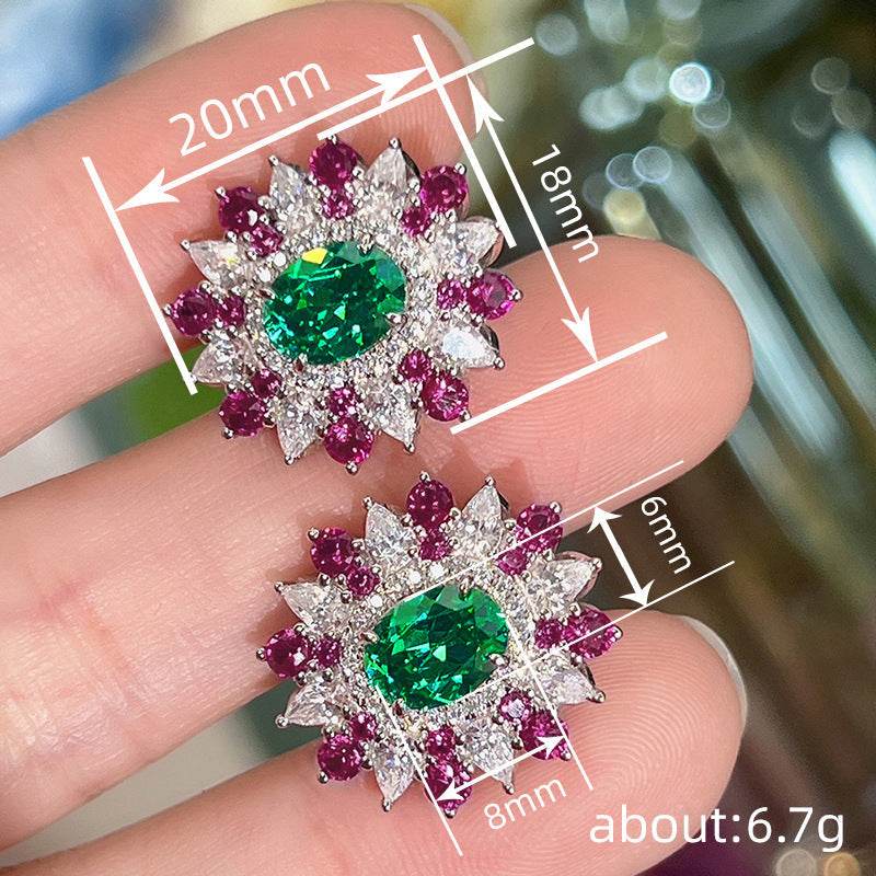 Colorful stud earrings with green oval zircon center and geometric flower design in white gold and copper