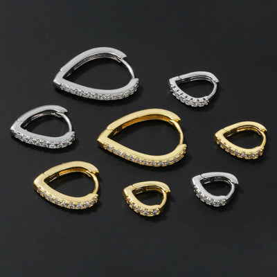 Simple Temperament Summer Cool Love Ear Clips in gold and silver heart-shaped copper with rhinestones on black background